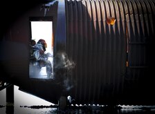 Airman 1st Class Chad Blakely, 1st Special Operations Civil Engineer Squadron fire rescuemen, extinguishes a fire at Hurlburt Field, Fla., April 8, 2015. Hurlburt fire rescuemen are capable of mitigating structural, aircraft and wild land fires, provide lifesaving emergency medical services and performing hazardous material mitigation and special operations such as trench, confined space and high/low angle rescue. (U.S. Air Force photo by Senior Airman Meagan Schutter)