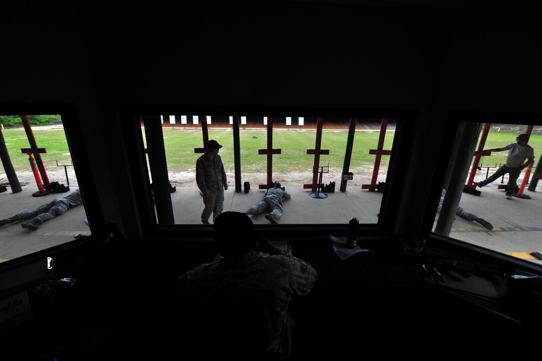 Staff Sgt. Brian Washington, 1st Special Operations Security Forces Squadron combat arms training and maintenance instructor, instructs qualification classes on the firing range, April 9, 2015, at Hurlburt Field, Fla. CATM instructors are subject matter experts on several weapon systems and must ensure Airmen are qualified to carry a weapon during deployments. (U.S. Air Force photo/Airman 1st Class Ryan Conroy) 