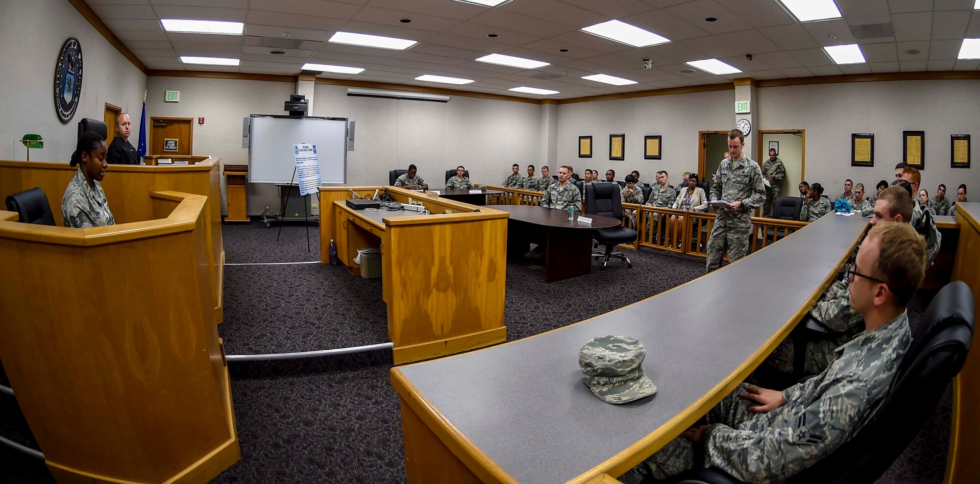 The 15th Wing Sexual Assault Prevention and Response office partnered with the 15th WG Judge Advocate office to host a mock sexual assault trial in the courtroom on Joint Base Pearl Harbor-Hickam, Hawaii, April 7, 2015. First Term Airman Center students served as the jury for the event, which featured real facts from a previous trial reenacted with a script by Sexual Assault Prevention and Response office volunteers. The hour-long educational demonstration documented the finding portion of the trial that the victim and accused perpetrator endure in court. (U.S. Air Force photo by Tech. Sgt. Terri Paden)