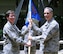 (Right to left) U.S. Air Force Col. Mickey Addison assumes command of the Air Force Installation and Mission Support Center Detachment 2 from Maj. Gen. Theresa Carter, AFIMSC commander, during an activation ceremony, April 9, 2015, Joint Base Pearl Harbor-Hickam, Hawaii. The Pacific detachment combines and overseas functions from the comptroller, civil engineer, communications, security forces, personnel and special services career fields. (U.S. Air Force photo by Staff Sgt. Amanda Dick/Released)