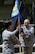 (Left to right) U.S. Air Force Maj. Gen. Theresa Carter, Air Force Installation and Mission Support Center commander, receives the guidon from Chief Master Sgt. Jose LugoSantiago, AFIMSC command chief, before handing it to the new AFIMSC Detachment 2 commander (not pictured) during an activation ceremony, April 9, 2015, Joint Base Pearl Harbor-Hickam, Hawaii. The Pacific detachment is the first detachment of the AFIMSC to activate in the Air Force and includes 60 Airmen who were formerly part of Headquarters Pacific Air Forces. (U.S. Air Force photo by Staff Sgt. Amanda Dick/Released)