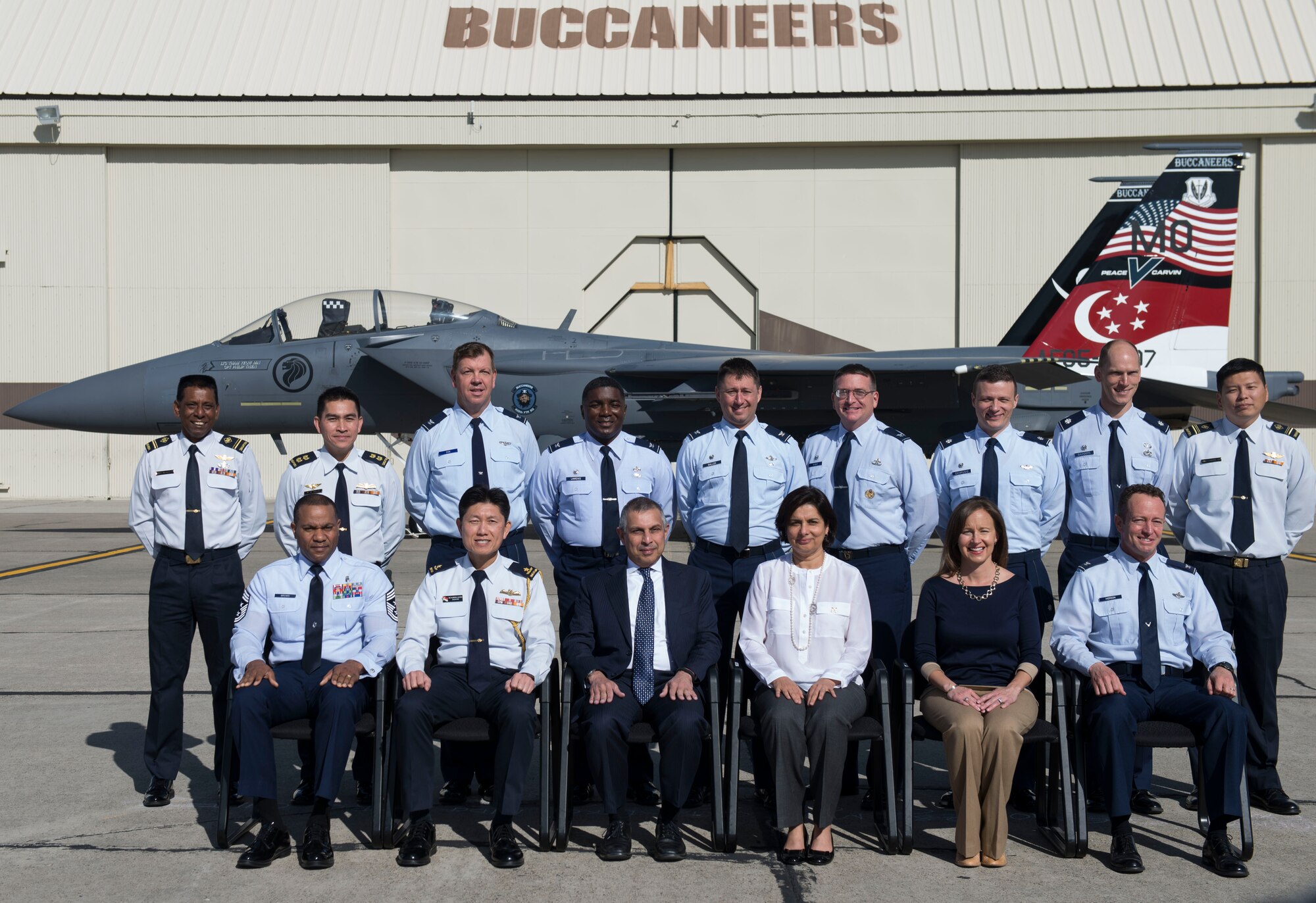 Base leadership and service members pose for a group photo with the Singapore Ambassador at Mountain Home Air Force Base, Idaho, April 9, 2015. The Ambassador was given a tour of the 428th Fighter Squadron which is home to the Buccaneers. (U.S. Air Force photo by Airman 1st Class Jessica H. Smith/RELEASED)
