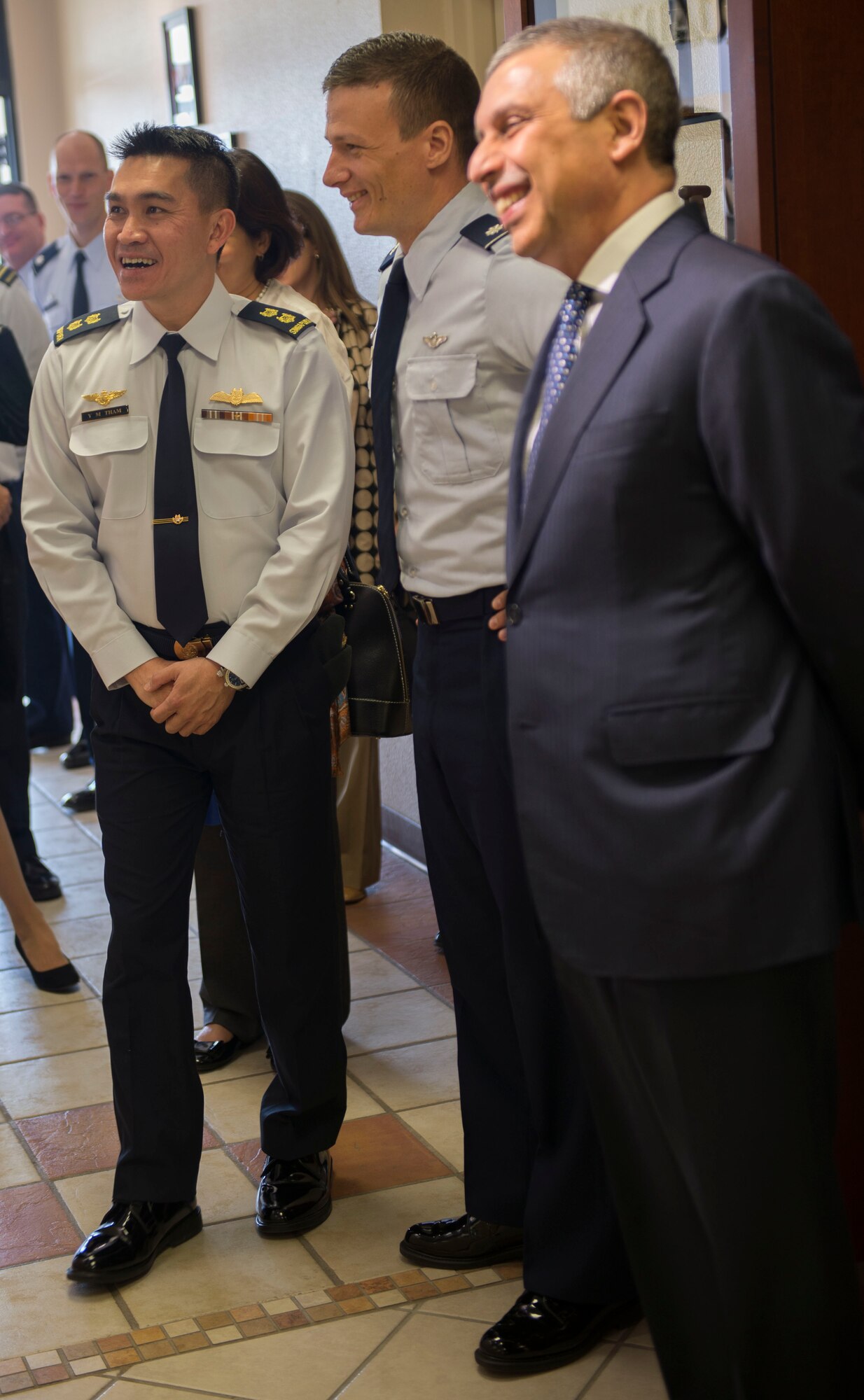 LTC Tham Yeow Min, PC V RSAF senior ranking officer and Lt. Col. Dominic Chiapusio, 428th Fighter Squadron commander discuss the history of the 428th FS with Ashok Kumar Mirpuri, Singapore Ambassador to the United States at Mountain Home Air Force Base, Idaho, April 9, 2015. The Ambassador was given a tour of the 428th FS. (U.S. Air Force photo by Airman 1st Class Jessica H. Smith/RELEASED)