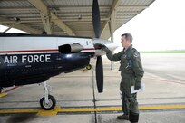 Capt. Don Clemson, 559th Flying Training Squadron instructor pilot trainee prepare the T-38 aircraft for a formation flight launch April 8, 2015 at Joint Base San Antonio-Randolph. (U.S. Air Force photo by Harold China/Released)