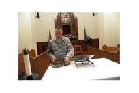 Tech. Sgt. Christopher McDonald, 502nd Air Base Wing chaplain’s assistant, sets up for the Protestant worship service April 8, 2015 at Joint Base San Antonio-Randolph’s Chapel One. (U.S. Air Force photo by Harold China/Released)