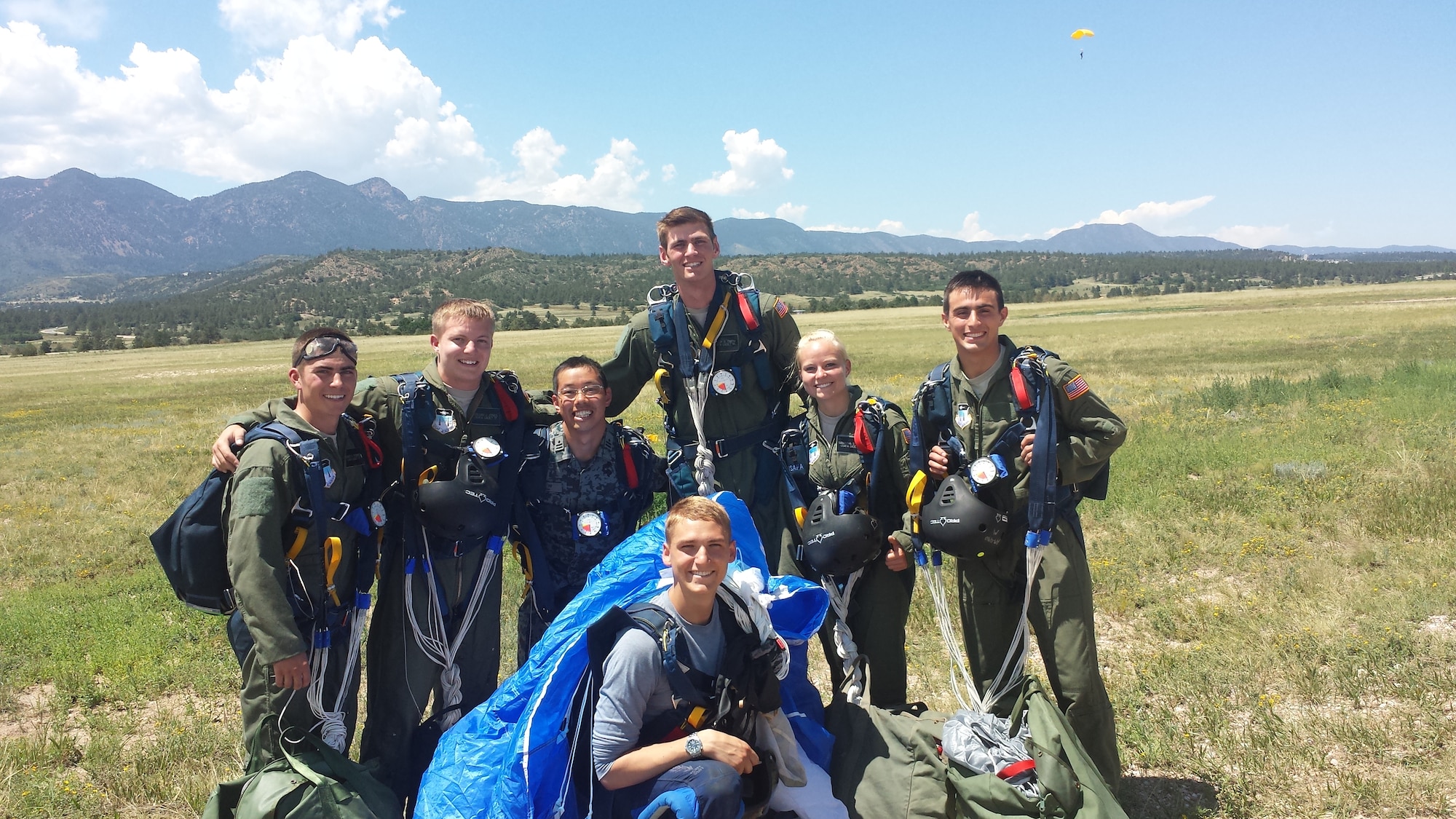 Maj. Ueda (center right) poses with his Airmanship 490 (Basic Jump Training) class in 2014. He earned his wings and learned more about Airmanship programs at the Academy. (U,S. Air Force/ courtesy photo)