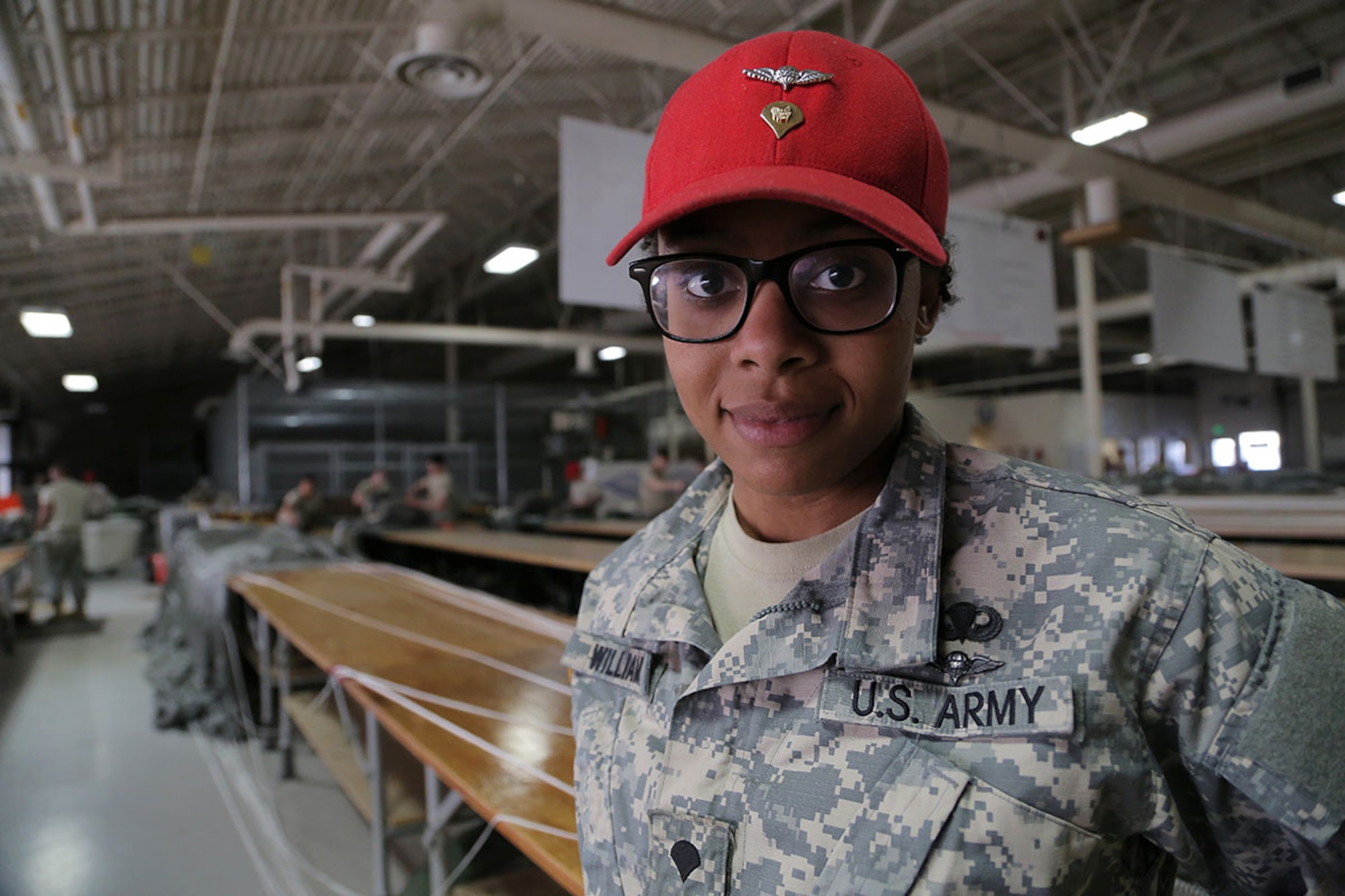 Spc. Brittany Williams, a native of Savannah, Ga., is a parachute rigger assigned to the 4th Quartermaster Company, 725 Brigade Support Battalion (Airborne), 4th Brigade Combat Team (Airborne), 25th Infantry Division, U.S. Army Alaska, on Joint Base Elmendorf-Richardson, Alaska, April 8, 2015. (U.S. Air Force photo/Alejandro Pena)