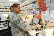 Tech. Sgt. Johnette Hutchinson, 359th Medical Support Squadron pharmacy technician, fills a prescription while matching a medication label in the database April 8, 2015 at Joint Base San Antonio-Randolph, Texas.  Members of the 359th MSS ensure full spectrum support operations for the 359th Medical Group and more than 54,000 beneficiaries.  (U.S. Air Force photo by Melissa Peterson/released)