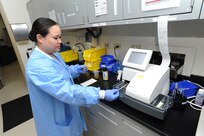 Tech. Sgt. Clarissa Spangler, 359th Medical Support Squadron laboratory technician, performs urinalysis testing April 8, 2015 at Joint Base San Antonio-Randolph, Texas.  Urinalysis testing provides results to doctors to patient care. Members of the 359th Medical Support Squadron ensure full spectrum support operations for the 359th Medical Group and more than 54,000 beneficiaries.         (U.S. Air Force photo by Melissa Peterson/released)