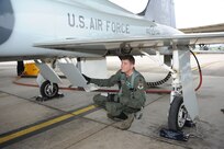 Lt. Col. Robert Lee, 560th Flying Training Squadron director of operations, performs a pre-flight check on a T-38 Talon aircraft April 8, 2015 at Joint Base San Antonio-Randolph, Texas.  During preflight inspections, aircrew members check the exterior and interior of aircraft to check for discrepancies and ensure serviceability.  The 560th FTS qualifies fighter and bomber pilots as instructor pilots in the T-38C Talon. The squadron currently flies a total of 8,800 hours annually in a fleet of nearly 40 aircraft and produces about 130 graduates per year. (U.S. Air Force photo by Melissa Peterson/released)