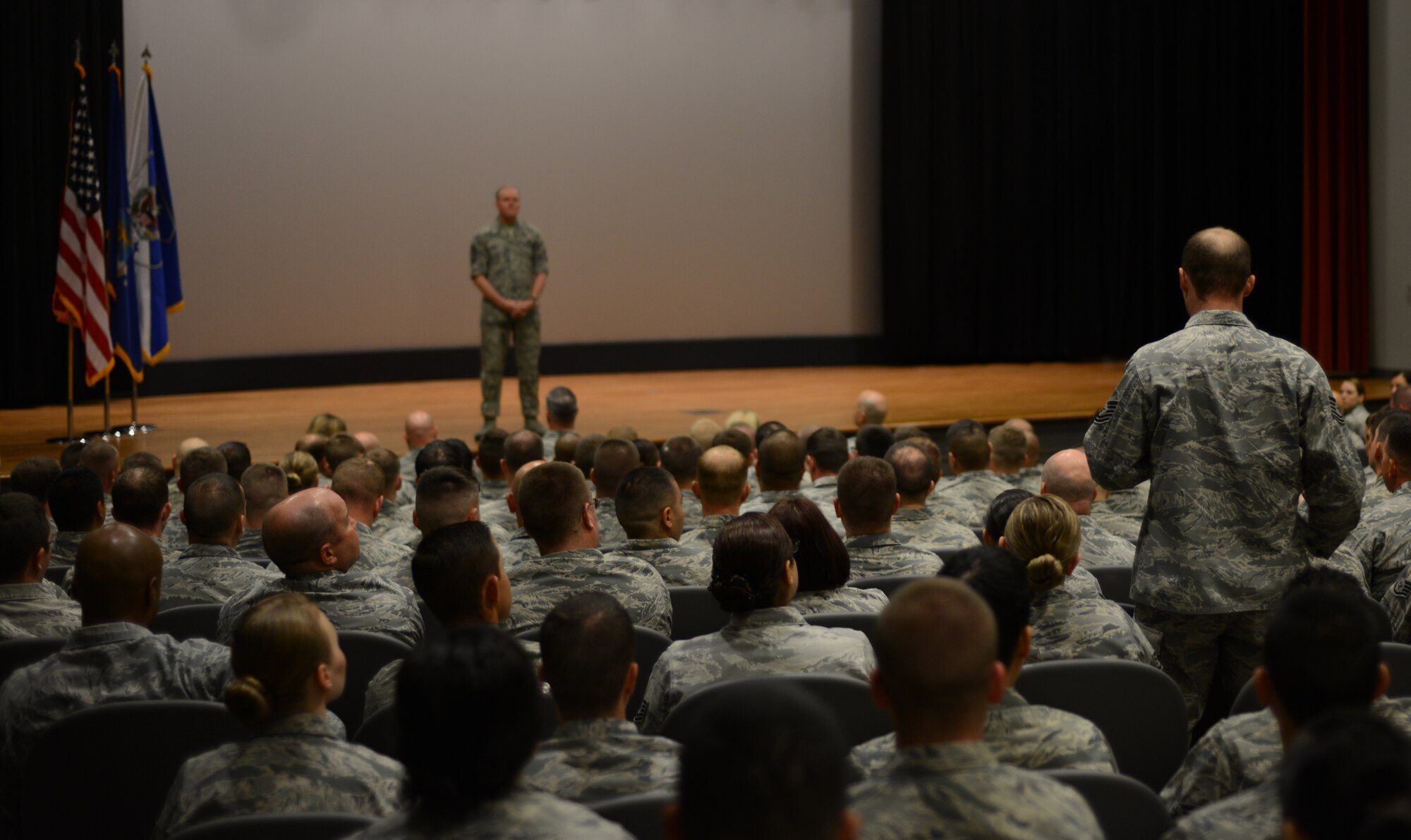 U.S. Air Force Tech. Sgt. Arthur Bloomingdale asks Chief Master Sgt. of the Air Force James A. Cody a question during a non-commissioned officer all-call April 7, 2015, at Dyess Air Force Base, Texas. During Cody’s visit, three all-calls were held where Airmen had the opportunity to dialogue openly with Cody. (U.S. Air Force photo by Airman 1st Class Autumn Velez/Released)