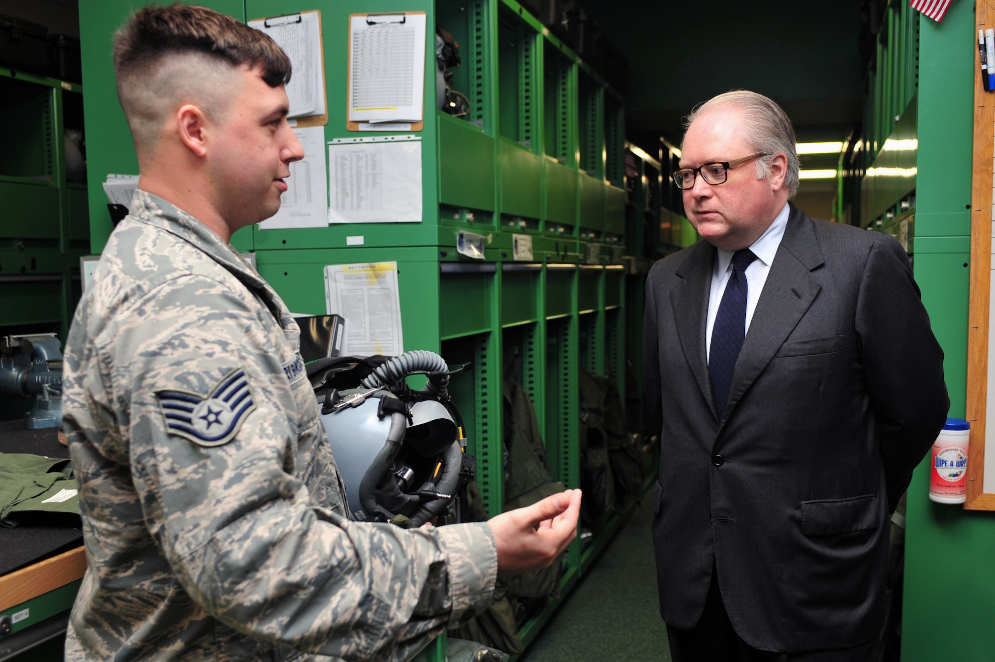Staff Sgt. Joshua Grygorcewicz, 4th Operations Support Squadron aircrew flight equipment  technician, showcases aircrew gear to Congressman George Holding, U.S. House of Representatives, during a tour, April 10, 2015, at Seymour Johnson Air Force Base, North Carolina. Holding, the representative for North Carolina’s 13th Congressional District, came to observe the operations involved in Exercise RAZOR TALON. (U.S. Air Force photo/Senior Airman John Nieves Camacho)