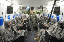 Staff Sgt. Miriam Hernandez, 359th Aerospace Medicine Squadron Aerospace and Operational Physiology technician, lectures students on the use of their altitude chamber equipment and procedures to ensure their comfort and safety during training April 8, 2015 at Joint Base San Antonio-Randolph, Texas.  Any students with Air Force specialties including enlisted aircrew, pararescue, remotely piloted aircraft, introduction to fighter fundamentals or pilot instructor training must first learn about human performance in airborne operations at the 359th Aerospace Medicine Squadron Aerospace and Operational Physiology Flight at JBSA-Randolph. A few tools used to train students include a Barany chair to help combat the motion sickness that comes with flying aircraft, an altitude chamber to familiarize students with hypoxia and a flight simulator for night vision goggle training. (U.S. Air Force photo by Joel Martinez/ Released)