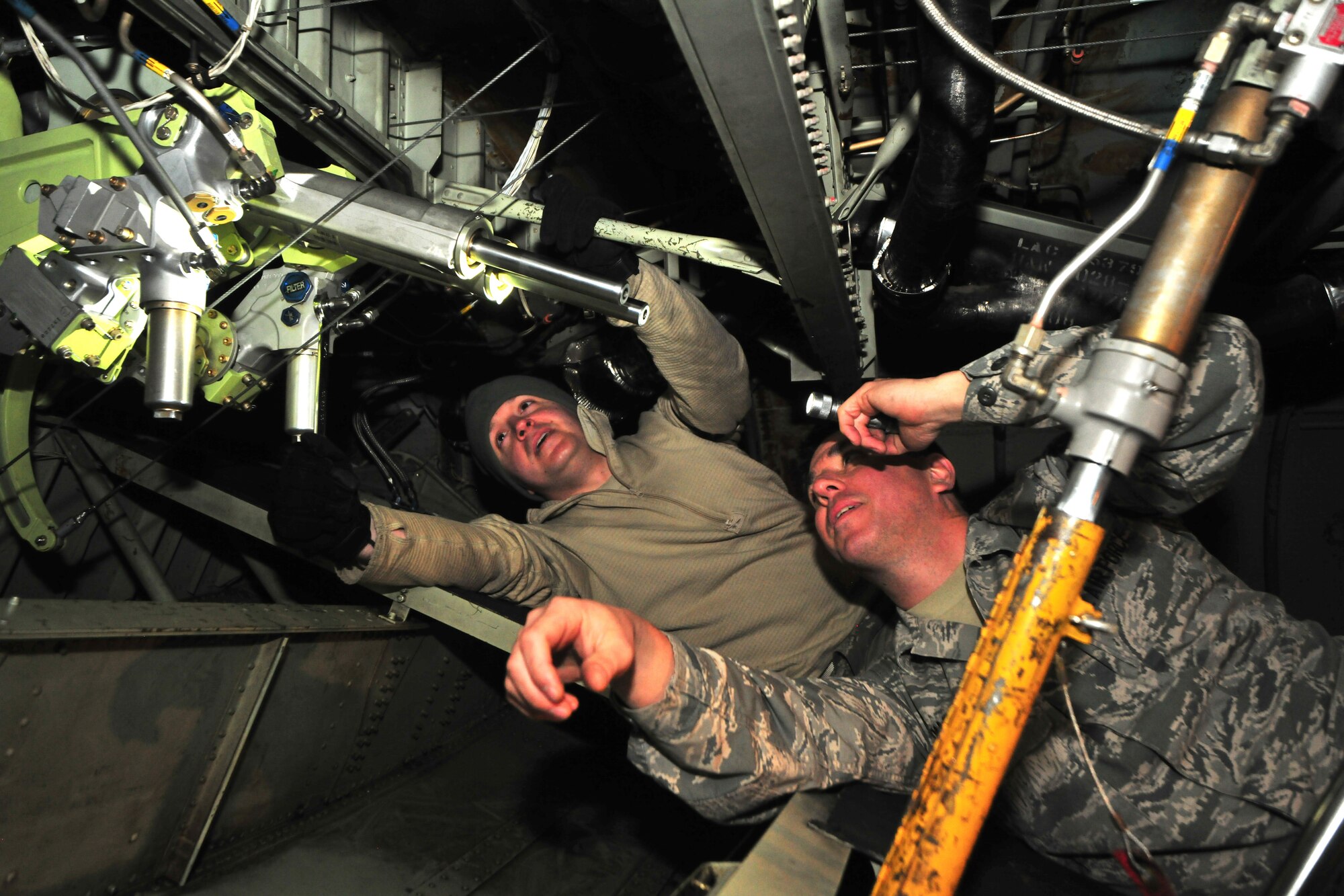 Senior Airman David Dower and Airman 1st Class Andrew Machalik of the 166th Maintenance Squadron, Delaware Air National Guard perform elevator boost pack maintenance on a C-130 Hercules transport aircraft at the New Castle ANG Base, Del., April 10, 2015. The aircraft will be flown April 11 during Operation Cyclone, a Delaware National Guard joint training exercise when Airmen and Soldiers will respond to a simulated tornado that has swept through New Castle County. Army Black Hawk helicopters will evacuate simulated wounded personnel to the ANG Base, with patients loaded onto C-130s for aerial evacuation. Separate from the exercise, on April 12, six C-130s will participate in the largest formation flown by the wing since departing for Southwest Asia in March 2003 to support Operation Iraqi Freedom. (U.S. Air National Guard photo by Staff Sgt. John Michaels)