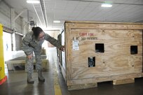 Staff Sgt. Mirna Lujano, 502nd Logistics Readiness Squadron inbound cargo NCO in charge, checks the label of an inbound cargo crate April 8, 2015 at Joint Base San Antonio-Randolph, Texas. The 502nd LRS ties into the extensive logistics system of the Air Force by focusing on the procurement, distribution, maintenance and replacement of materiel and personnel. This system includes many functions, such as vehicle transportation, aircraft and vehicle maintenance, air transportation, supply, acquisitions, fuels, logistics planning and traffic management. (U.S. Air Force photo by Joel Martinez/ Released)