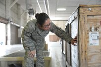 Staff Sgt. Mirna Lujano, 502nd Logistics Readiness Squadron inbound cargo NCO in charge, checks the label of an inbound cargo crate April 8, 2015 at Joint Base San Antonio-Randolph, Texas. The 502nd LRS ties into the extensive logistics system of the Air Force by focusing on the procurement, distribution, maintenance and replacement of materiel and personnel. This system includes many functions, such as vehicle transportation, aircraft and vehicle maintenance, air transportation, supply, acquisitions, fuels, logistics planning and traffic management. (U.S. Air Force photo by Joel Martinez/ Released)