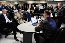 Mass. Governor Charlie Baker and Public Safety Secretary Daniel Bennett, Maj. Gen. L. Scott Rice, Mass. adjutant general and Patsy Reeves, Air Force Life Cycle Management Center executive director, are briefed by Joel Rodriquez, a contractor at Hanscom AFB, during a visit to the Hanscom Collaboration and Innovation Center April 10. The governor also saw program demonstrations and received briefings from each of the program executive officers and the base commander. (U.S. Air Force photo by Mark Herlihy)