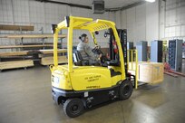Staff Sgt. Mirna Lujano, 502nd Logistics Readiness Squadron inbound cargo NCO in charge, uses a fork-lift to move a crate April 8, 2015 at Joint Base San Antonio-Randolph, Texas.  The 502nd LRS ties into the extensive logistics system of the Air Force by focusing on the procurement, distribution, maintenance and replacement of materiel and personnel. This system includes many functions, such as vehicle transportation, aircraft and vehicle maintenance, air transportation, supply, acquisitions, fuels, logistics planning and traffic management. (U.S. Air Force photo by Joel Martinez/ Released)