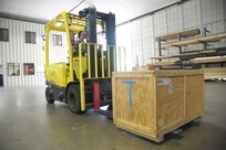 Staff Sgt. Mirna Lujano, 502nd Logistics Readiness Squadron inbound cargo NCO in charge, uses a fork-lift to move a crate April 8, 2015 at Joint Base San Antonio-Randolph, Texas.  The 502nd LRS ties into the extensive logistics system of the Air Force by focusing on the procurement, distribution, maintenance and replacement of materiel and personnel. This system includes many functions, such as vehicle transportation, aircraft and vehicle maintenance, air transportation, supply, acquisitions, fuels, logistics planning and traffic management. (U.S. Air Force photo by Joel Martinez/ Released)