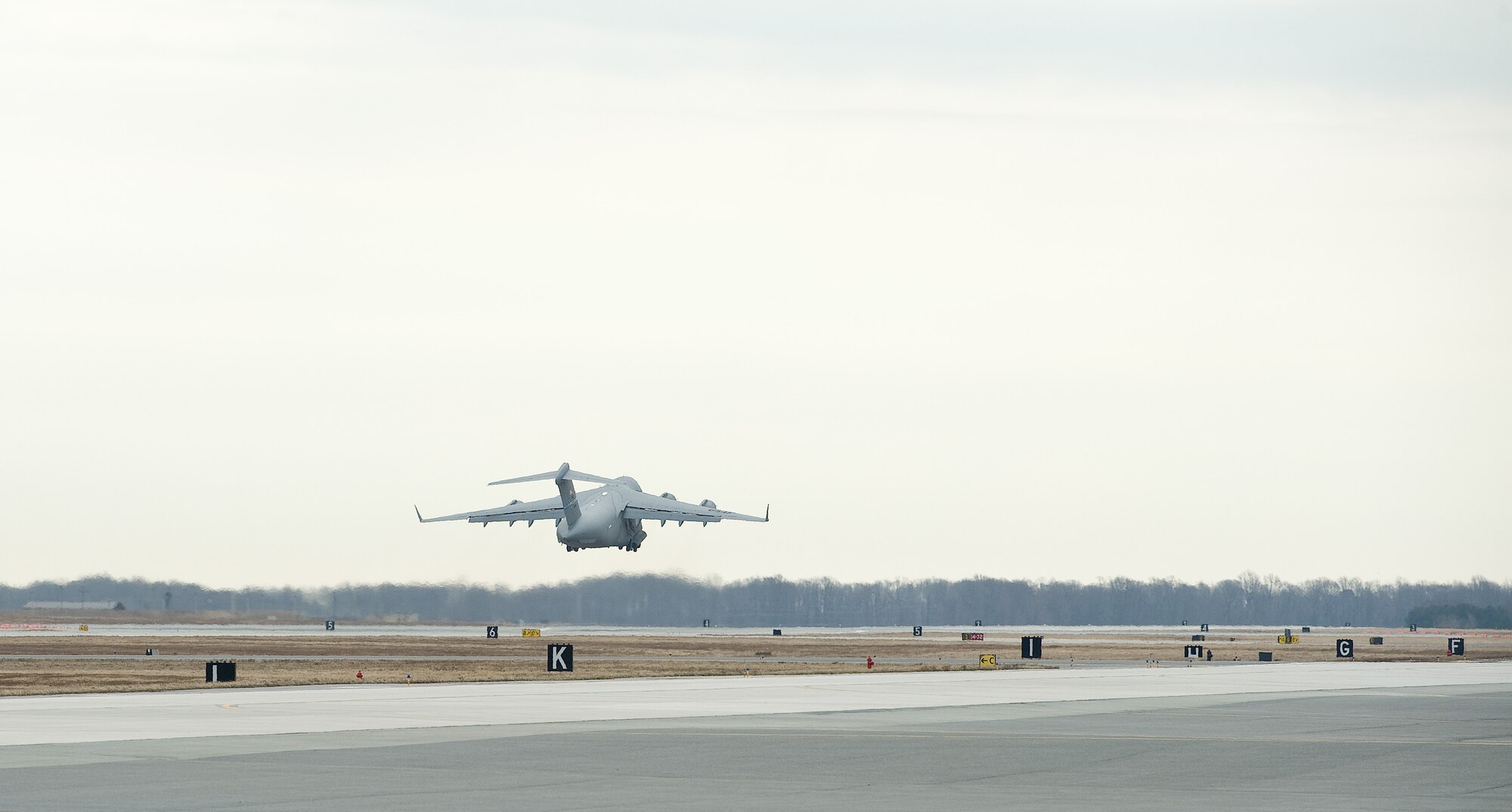 An all-female C-17 Globemaster III aircrew from the 3d Airlift Squadron takes off on a local training mission March 25, 2015, at Dover AFB, Del. The three pilots and one loadmaster were unintentionally scheduled to fly as an aircrew during National Women's History Month. (U.S. Air Force photo/Roland Balik)