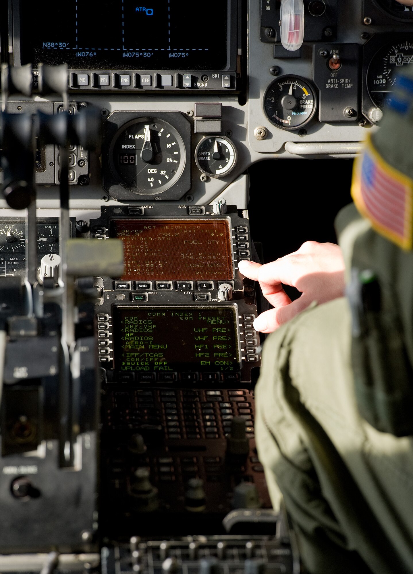 Capt. Ellen Canup, 3d Airlift Squadron instructor pilot, programs the mission computer on a C-17 Globemaster III prior to departure March 25, 2015, at Dover AFB, Del. Canup was part of an all-female aircrew from the 3d AS consisting of three pilots and a loadmaster during a local training mission. (U.S. Air Force photo/Roland Balik)