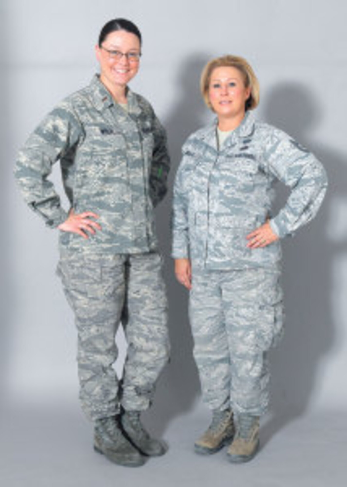Second Lt. Tanya Wren, 56th Fighter Wing Public Affairs chief of community relations, and Tech. Sgt. Priscilla Noll, 56th Civil Engineer Squadron furnishing management office NCO in charge, provided first aid to an elderly woman who suffered a head injury during a head-on collision. (U.S. Air Force photo/ Senior Airman Marcy Copeland)