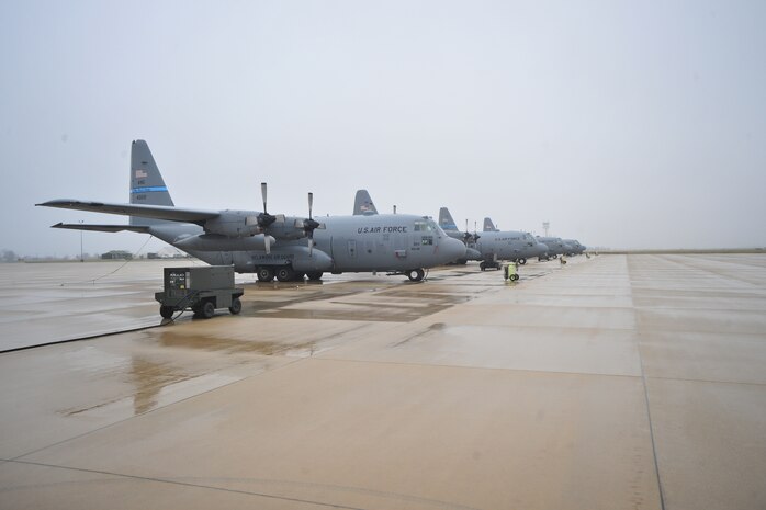 C-130 Hercules transport aircraft of the 166th Airlift Wing, Delaware Air National Guard at the New Castle ANG Base, Del., April 10, 2015. The aircraft will be flown April 11 during Operation Cyclone, a Delaware National Guard joint training exercise when Airmen and Soldiers will respond to a simulated tornado that has swept through New Castle County. Army Black Hawk helicopters will evacuate simulated wounded personnel to the air base, with patients loaded onto C-130s for aerial evacuation. Separate from the exercise, on April 12, six C-130s will participate in the largest formation flown by the wing since departing for Southwest Asia in March 2003 to support Operation Iraqi Freedom. (U.S. Air National Guard photo by Staff Sgt. John Michaels)