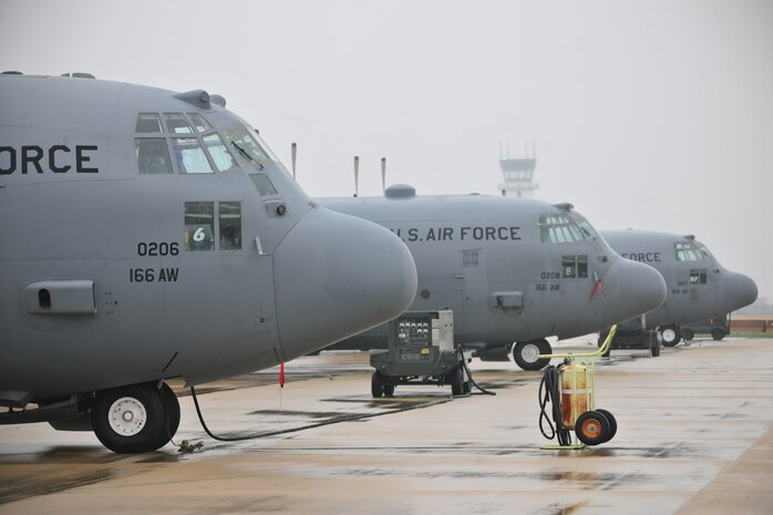 C-130 Hercules transport aircraft of the 166th Airlift Wing, Delaware Air National Guard at the New Castle ANG Base, Del., April 10, 2015. The aircraft will be flown April 11 during Operation Cyclone, a Delaware National Guard joint training exercise when Airmen and Soldiers will respond to a simulated tornado that has swept through New Castle County. Army Black Hawk helicopters will evacuate simulated wounded personnel to the ANG Base, with patients loaded onto C-130s for aerial evacuation. Separate from the exercise, on April 12, six C-130s will participate in the largest formation flown by the wing since departing for Southwest Asia in March 2003 to support Operation Iraqi Freedom. (U.S. Air National Guard photo by Staff Sgt. John Michaels)