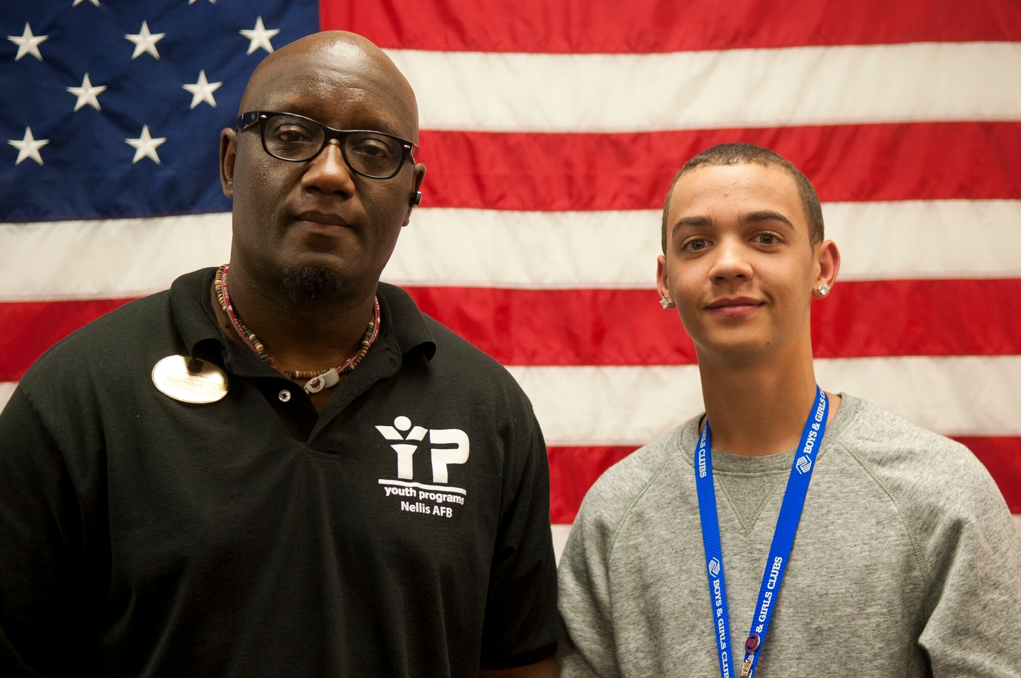 Davin Watson, 99th Force Support Squadron youth center teen director, and Caleb Franceschini, Nellis Air Force Base Youth of the Year, pose for a photo at the Youth Center on Nellis AFB, Nev., March 11, 2015. Franceschini also won Nevada’s Military Youth of the Year award and will go on to compete at the regional level in Calif. in Aug. (U.S. Air Force photo by Airman 1st Class Mikaley Towle)