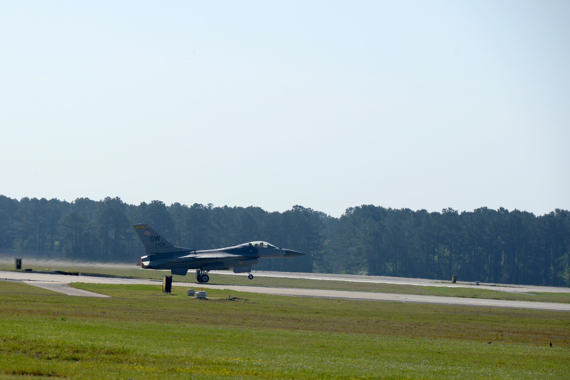 U.S. Air Force Maj. Mike Chebino, 9th Air Force aide de Camp for Maj. Gen. H.D. Polumbo Jr., 9th Air Force commander, takes off in an F-16CM Fighting Falcon for a functional check flight at Shaw Air Force Base, S.C., April 8, 2015. Chebino flew the aircraft at speeds in excess of 1.8 Mach, and pulled nine times the force of earth’s gravity to test out the jet’s repairs. (U.S. Air Force photo by Senior Airman Jonathan Bass/Released)
