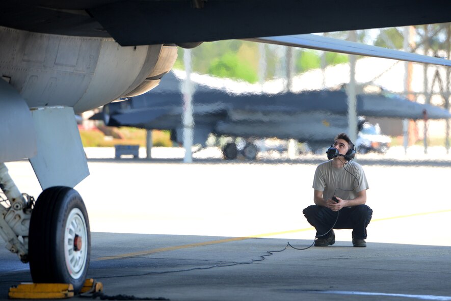 U.S. Air Force Senior Airman Rafael Martinez, 20th Aircraft Maintenance Squadron dedicated crew chief, speaks to Maj. Mike Chebino, 9th Air Force aide de Camp to Maj. Gen. H.D. Polumbo Jr., 9th Air Force commander, during a pre-flight check in an F-16CM Fighting Falcon before takeoff at Shaw Air Force Base, S.C., April 8, 2015. Chebino conducted the functional check flight for the jet after it spent more than 600 days on the ground for repairs, made by Martinez. (U.S. Air Force photo by Senior Airman Jonathan Bass/Released)