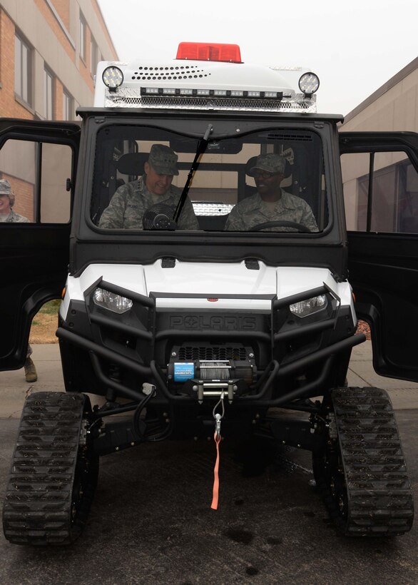 Staff Sgt. Ricky Dunbar, Medical Operation Squadron NCO in charge of ambulance services, explains the capabilities of an all-terrain ambulance to Lt. Gen. Chris Nowland, 12th Air Force commander, during his visit at Ellsworth Air Force Base, S.D., April 8. 2015. Throughout the day, Nowland met with several maintenance, operations and support Airmen who successfully carry out the mission. (U.S. Air Force photo by Airman 1st Class Rebecca Imwalle/Released) 