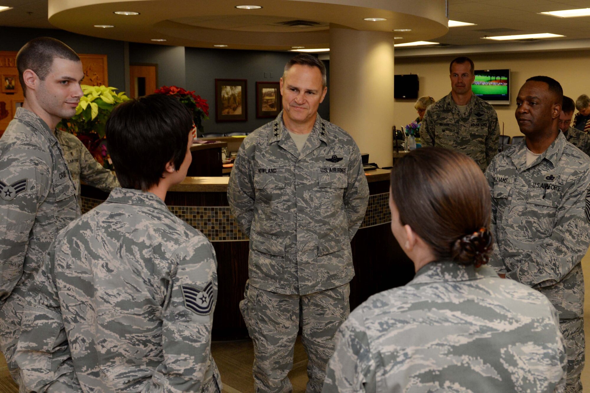Lt. Gen. Chris Nowland, 12th Air Force commander, speaks with Airmen from the 28th Medical Operation Squadron Family Health Clinic during his visit at Ellsworth Air Force Base, S.D., April 8. 2015. Nowland toured the facility and congratulated Airmen on their contributions toward winning the 2014 Air Force Medical Service Outstanding Patient Center Medical Home award. (U.S. Air Force photo by Airman 1st Class Rebecca Imwalle/Released)