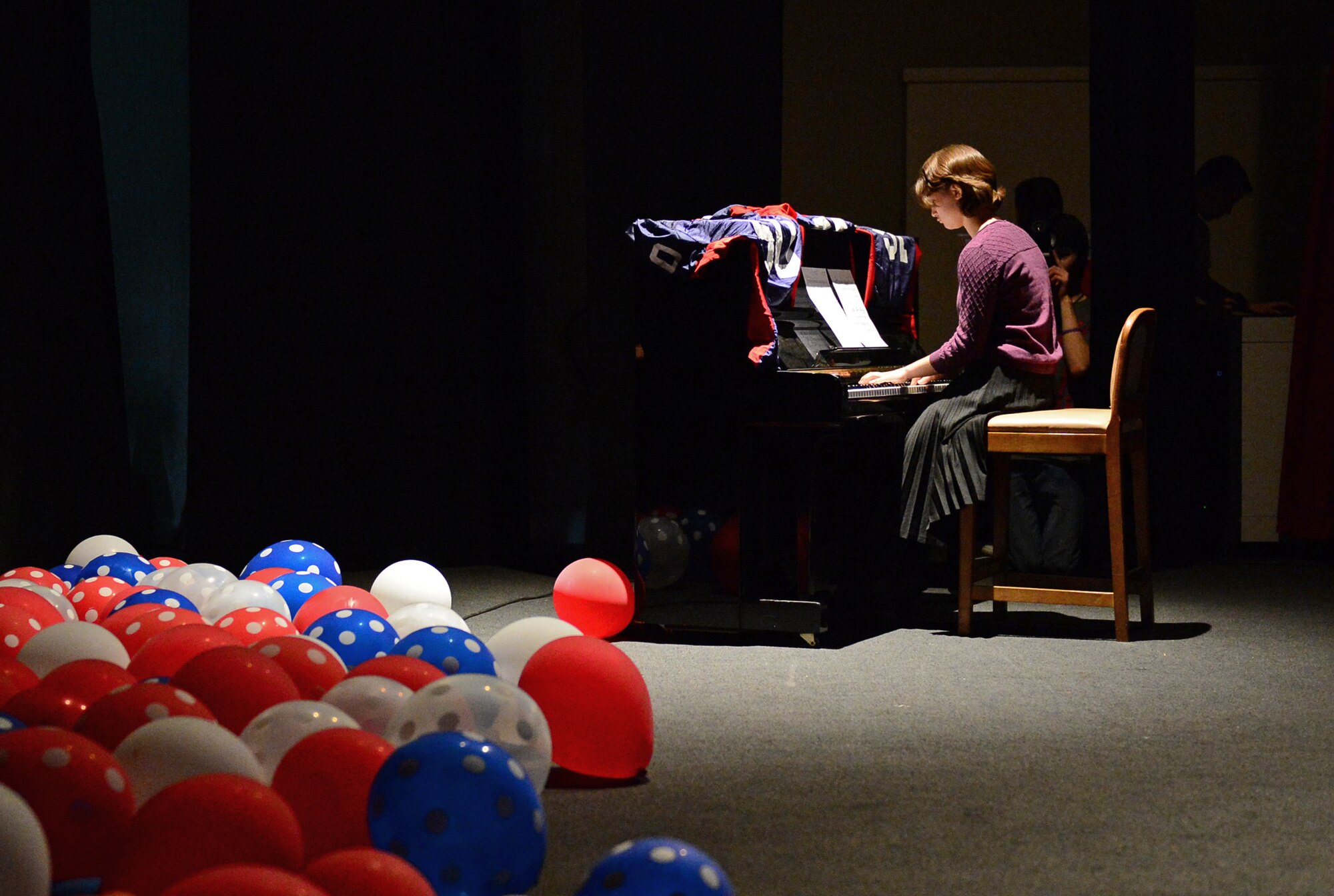 Marisa Peredo, a Lakenheath High School student, performs “One Summer’s Day” during a talent show at Royal Air Force Lakenheath, England, April 2, 2015. The students and faculty began preparing for this year’s show in December. (U.S. Air Force photo by Airman 1st Class Erin R. Babis/Released)