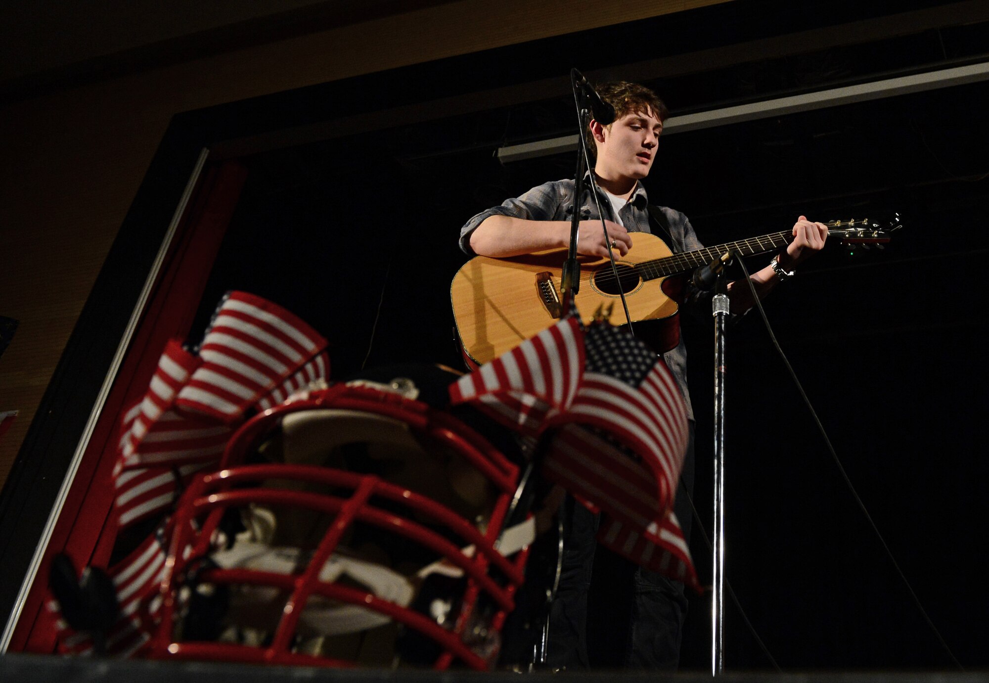 Preston Booth, a Lakenheath High School student, performs “Hero of War” during a talent show at Royal Air Force Lakenheath, England, April 2, 2015. The show gave students the opportunity to showcase their talents outside of the academic environment. (U.S. Air Force photo by Airman 1st Class Erin R. Babis/Released)