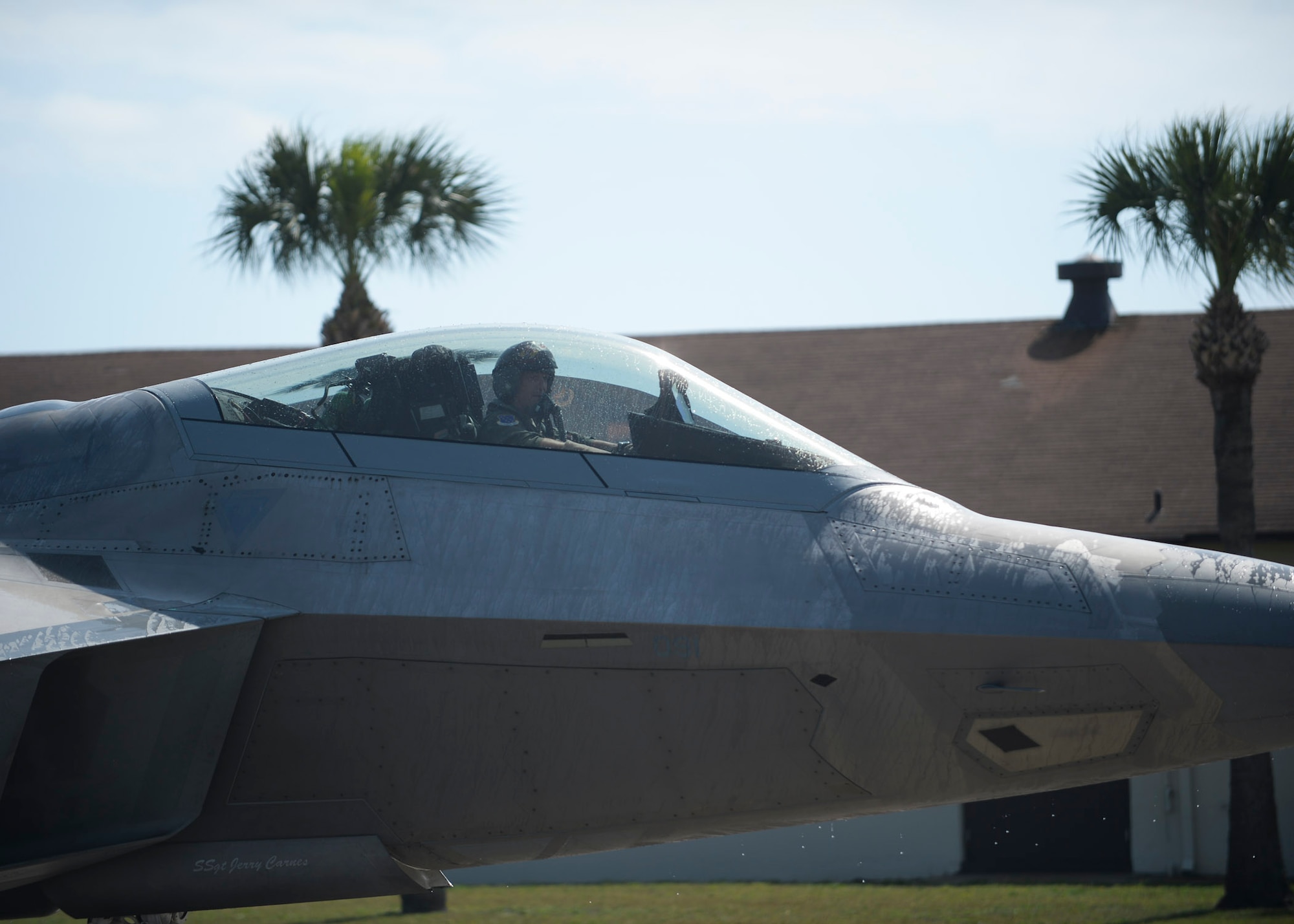 Col. Scott Crogg, 44th Fighter Group commander, taxis in a F-22A Raptor during his fini flight March 25, 2015 at Tyndall Air Force Base, Fla. Crogg, an Air Force Academy graduate, led and flew over 140 combat missions throughout his 24-plus year career. Crogg, a command pilot with more than 3,300 flying hours in the F-16 and F-22, retires this month. The 44th Fighter Group is a geographical-separated unit within the 301st Fighter Wing. (U.S. Air Force photo by Airman 1st Class Dustin Mullen/Released)

