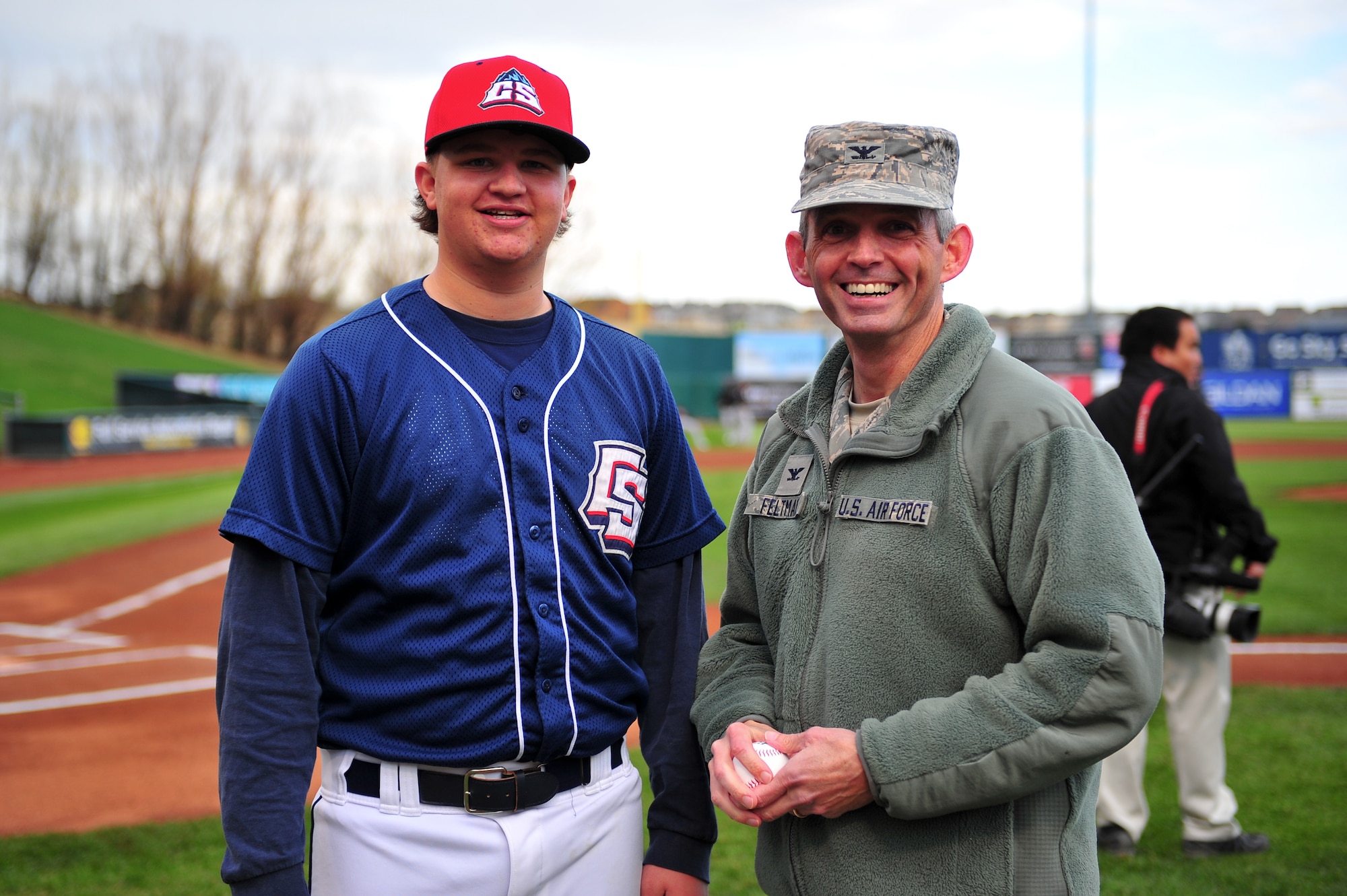 Air Force Reserve Col. Damon S. Feltman, 310th Space Wing Commander, poses with Christian Andreas, Colorado Springs Sky Sox batboy April 8, 2015, at the Security Service Field in Colorado Springs, Colo. Andreas was the catcher for the first pitch. The Sky Sox are the Triple-A minor league baseball affiliation of Major League Baseball's Milwaukee Brewers.
(U.S. Air Force photo/Tech. Sgt. Nicholas B. Ontiveros)