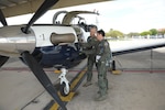 Capt. Dave Markus (left), 559th Flying Training Squadron flight instructor, and Maj. Neil Gregory, 559th FTS student, perform a pre-flight inspection, before their flight March 26 at Joint Base San Antonio-Randolph. (U.S. Air Force photo by Joel Martinez)