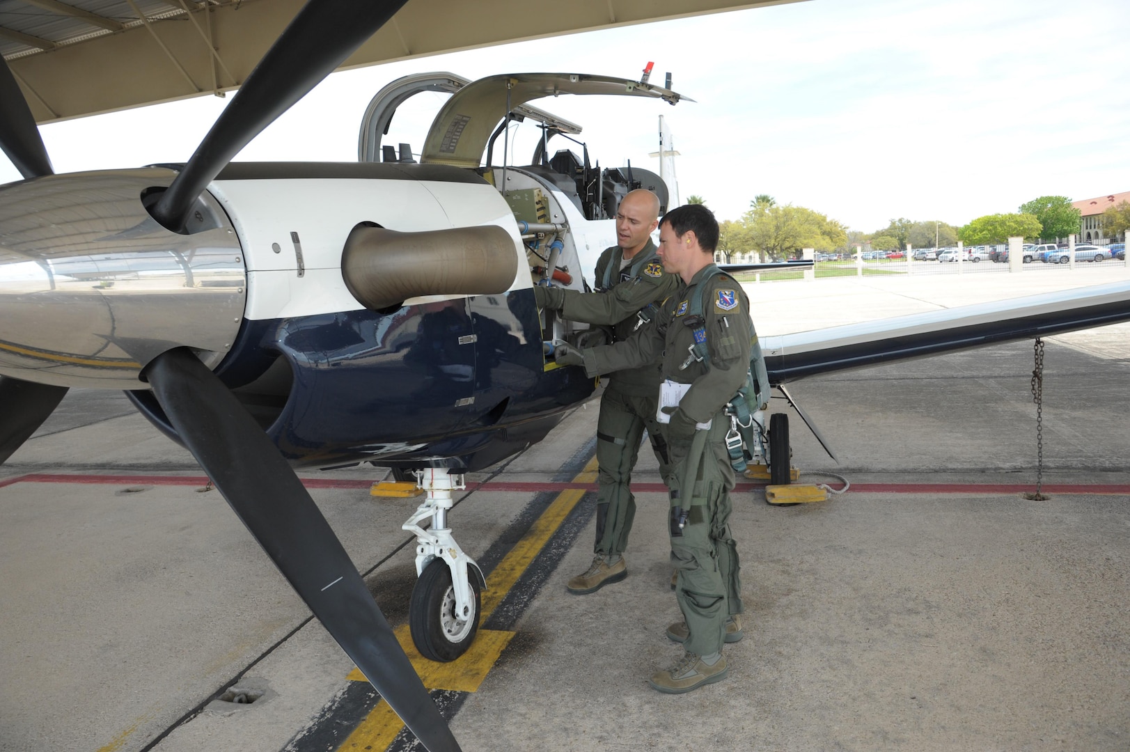 Capt. Dave Markus (left), 559th Flying Training Squadron flight instructor, and Maj. Neil Gregory, 559th FTS student, perform a pre-flight inspection, before their flight March 26 at Joint Base San Antonio-Randolph. (U.S. Air Force photo by Joel Martinez)