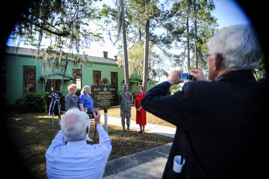 Garden Club of Georgia members pose for photos with a Blue Star Memorial Marker after a Dedication ceremony April 7, 2015 at Moody AFB, Ga. The marker, placed in front of the George W. Bush Air Park near the Austin Ellipse, joins 149 Blue Star Memorial Markers in the state of Georgia. (U.S. Air Force photo by Andrea Jenkins/Released)