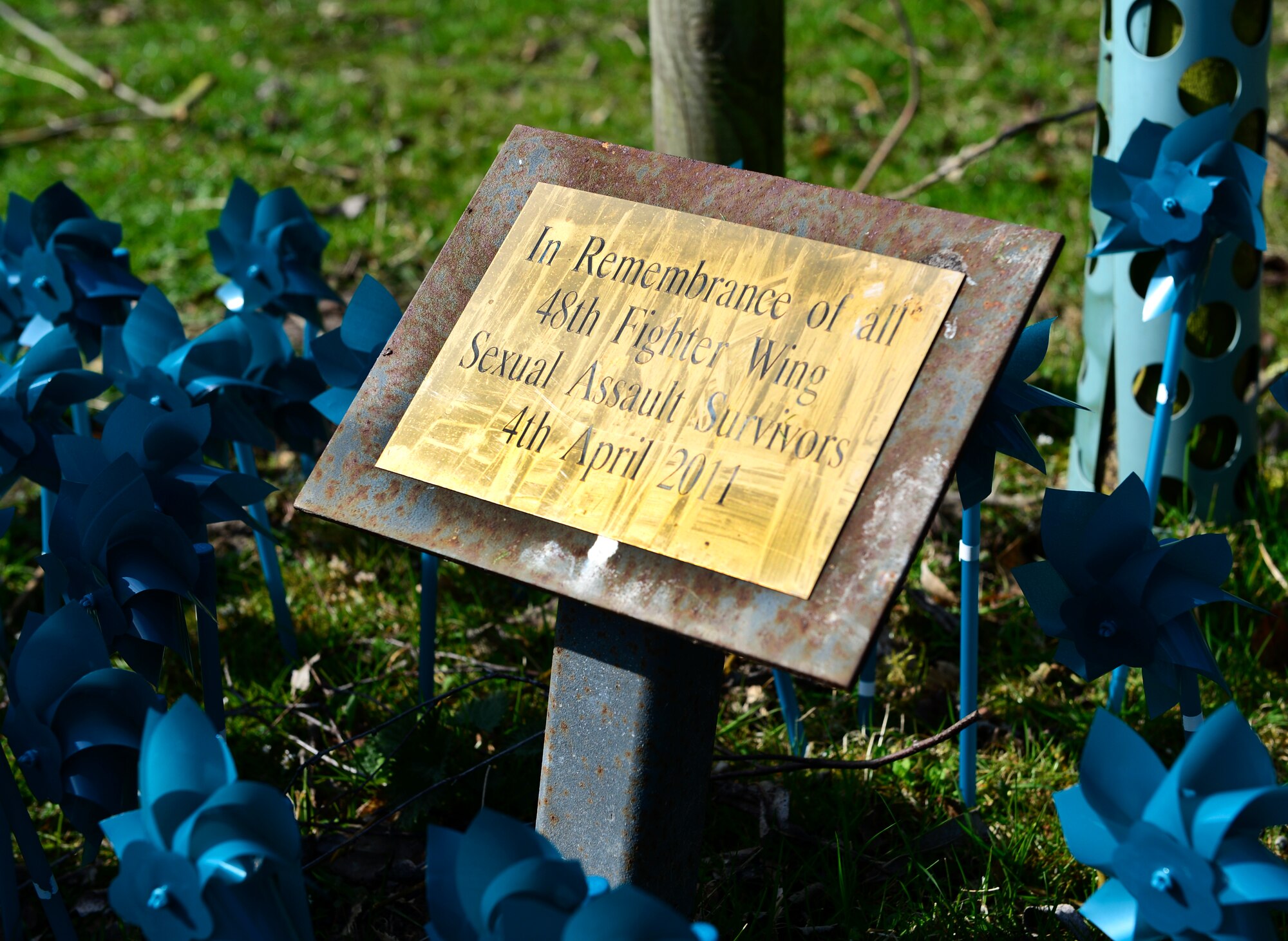 Teal pinwheels were placed at the duck pond on Royal Air Force Lakenheath, England, April 10, 2015 to commemorate survivors of sexual assault from the past three years. Throughout the month of April, the Sexual Assault Prevention and Response and the Family Advocacy office will hold numerous events including Handbag Bingo and a ‘Stop the Violence’ Fitness Challenge, to celebrate Sexual Assault and Child Abuse Awareness Month. (U.S. Air Force photo by Airman 1st Class Dawn M. Weber/Released)