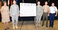 From left: Rear Adm. Rebecca McCormick-Boyle, commander, Navy Medicine Education and Training Command; Lt. Gen. Perry L. Wiggins, commanding general of U.S. Army North (Fifth Army) and the senior Army commander of Joint Base San Antonio-Fort Sam Houston and JBSA-Camp Bullis; Brig. Gen. Robert Miller, Medicine Education and Training Campus commandant; Lt. Col. Eric Dill, 4th Reconnaissance Battalion and 4th Marine Division commanding officer; and Cmdr. Benjamin Golightly, Coast Guard Crytologic Unit Texas commanding officer, gathered at the METC Academic Center April 1 to sign the Sexual Assault Awareness and Prevention month proclamation.