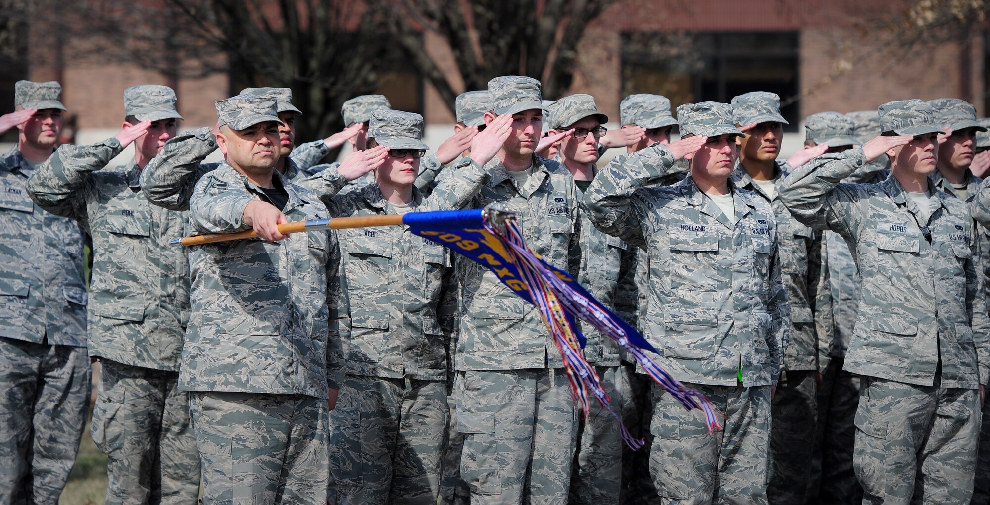 Airmen render salutes during a wing retreat ceremony at Whiteman Air Force Base, Mo., March 27, 2015. Various base units from the 509th Bomb Wing participated in the ceremony. (U.S. Air Force photo by Staff Sgt. Nick Wilson/Released)