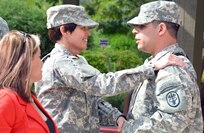 Maj. Gen. Jimmie O. Keenan (center), the U.S. Army Medical Command’s deputy commanding general (operations), presents the Soldier’s Medal to Army 1st Lt. John M. Arroyo Jr. (right), as his wife, Angel, looks on during a ceremony Monday at the Warrior and Family Support Center on Joint Base San Antonio-Fort Sam Houston. The Soldier’s Medal is the highest honor a Soldier can receive for an act of valor in a non-combat situation. To find out more about Arroyo,
Photo by Robert Shields