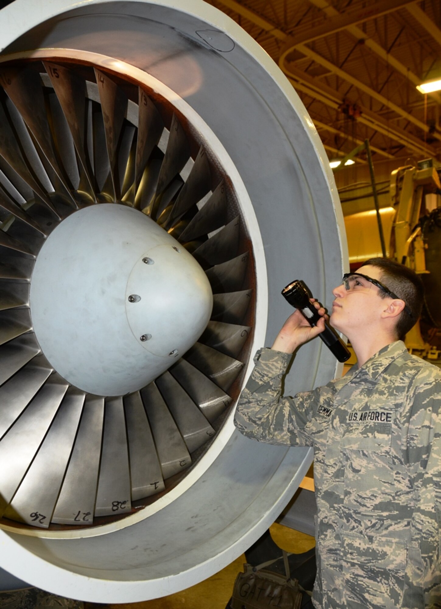 Airman 1st Class Michael Gemma, 175th Maintenance Squadron aircraft engine mechanic, inspects the blades of a T-34 engine at Warfield Air National Guard Base in Baltimore, Md. Gemma is the 175th Wing April Airman Spotlight. (U.S. Air National Guard photo by Tech. Sgt. David Speicher/RELEASED)