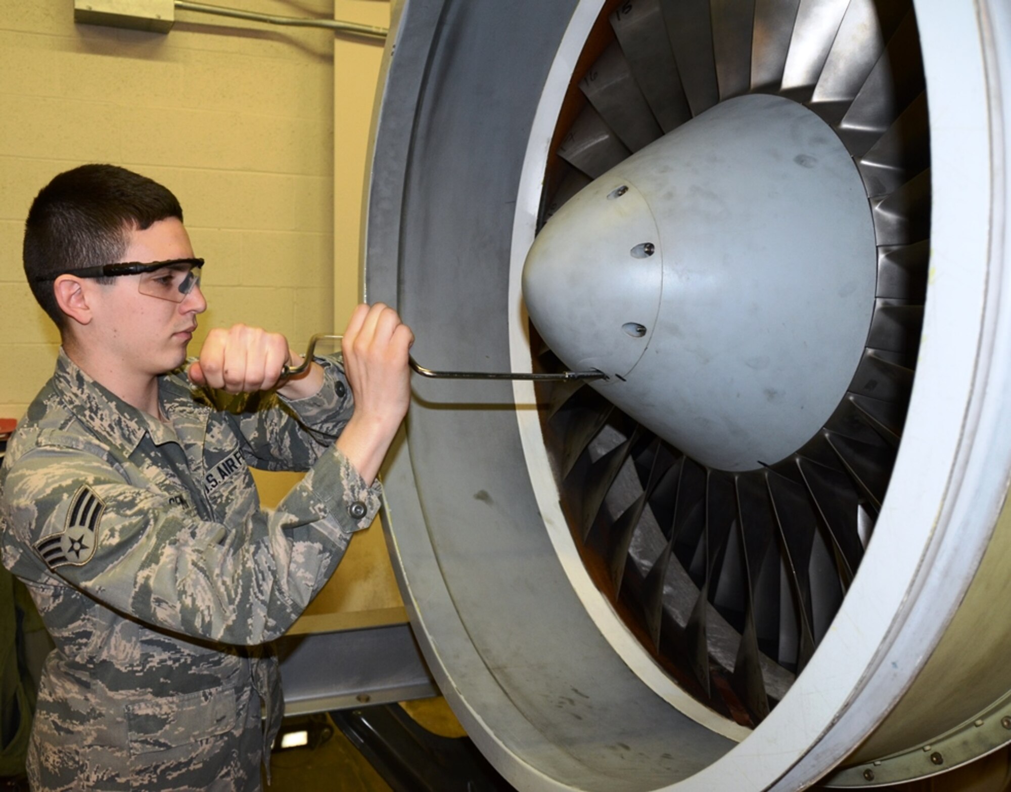 Airman 1st Class Michael Gemma, 175th Maintenance Squadron aircraft engine mechanic, works on a T-34 engine at Warfield Air National Guard Base in Baltimore, Md. Gemma is the 175th Wing April Airman Spotlight. (U.S. Air National Guard photo by Tech. Sgt. David Speicher/RELEASED)