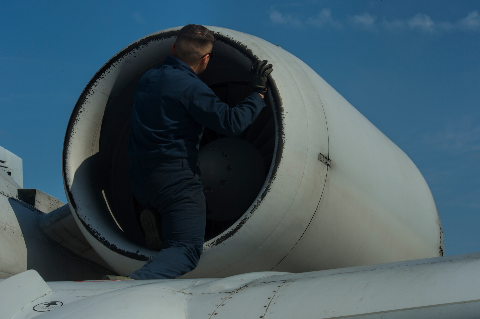 A 354th Expeditionary Fighter Squadron crew chief inspects the engine of a U.S. Air Force A-10 Thunderbolt II attack aircraft during a theater security package deployment to Namest Air Base, Czech Republic, April 9, 2015. Pre- and post-flight inspections are performed on the aircraft to ensure it is safe to fly. (U.S. Air Force photo by Staff Sgt. Christopher Ruano/Released) 