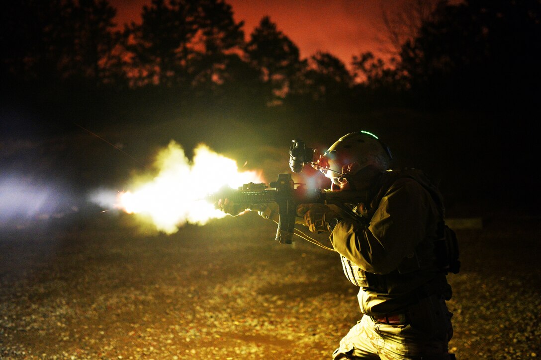 Air Force Tech. Sgt. Jason Cangemi test fires an M4 carbine during live-fire training at the firing range in Westhampton Beach, N.Y., April 9, 2015. Under real-world tactical conditions, a suppressor likely would mute the muzzle flash. Cangemi is assigned to the New York Air National Guard.