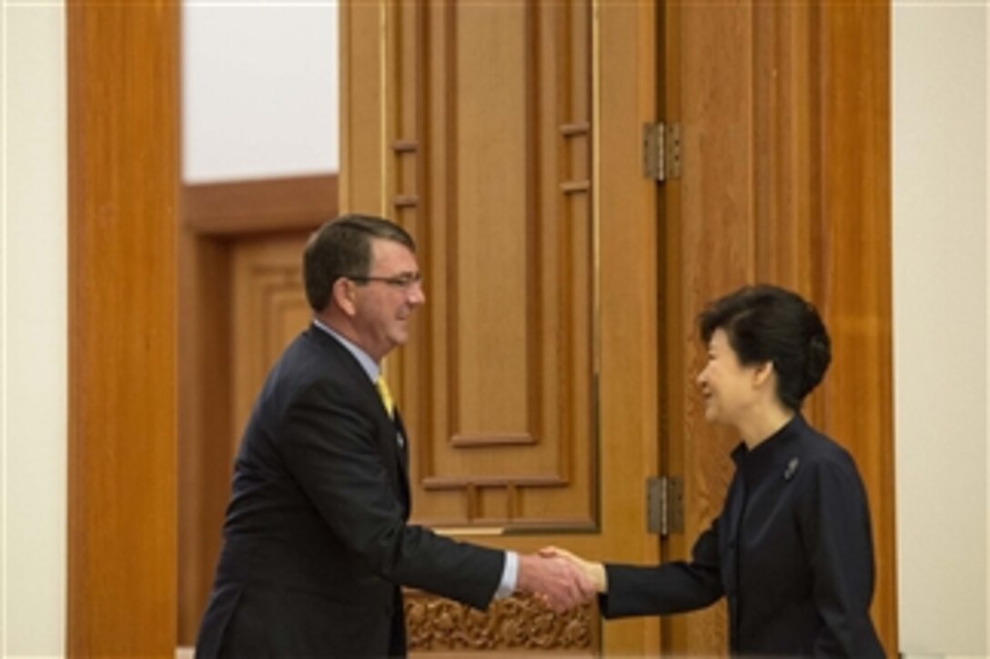 U.S. Defense Secretary Ash Carter, left, shakes hands with South Korean President Park Geun-hye at the Blue House in Seoul, South Korea, April 10, 2015. Carter is on a visit to the U.S. Pacific Command Area of Responsibility to make observations for the future force and the rebalance to the Pacific.