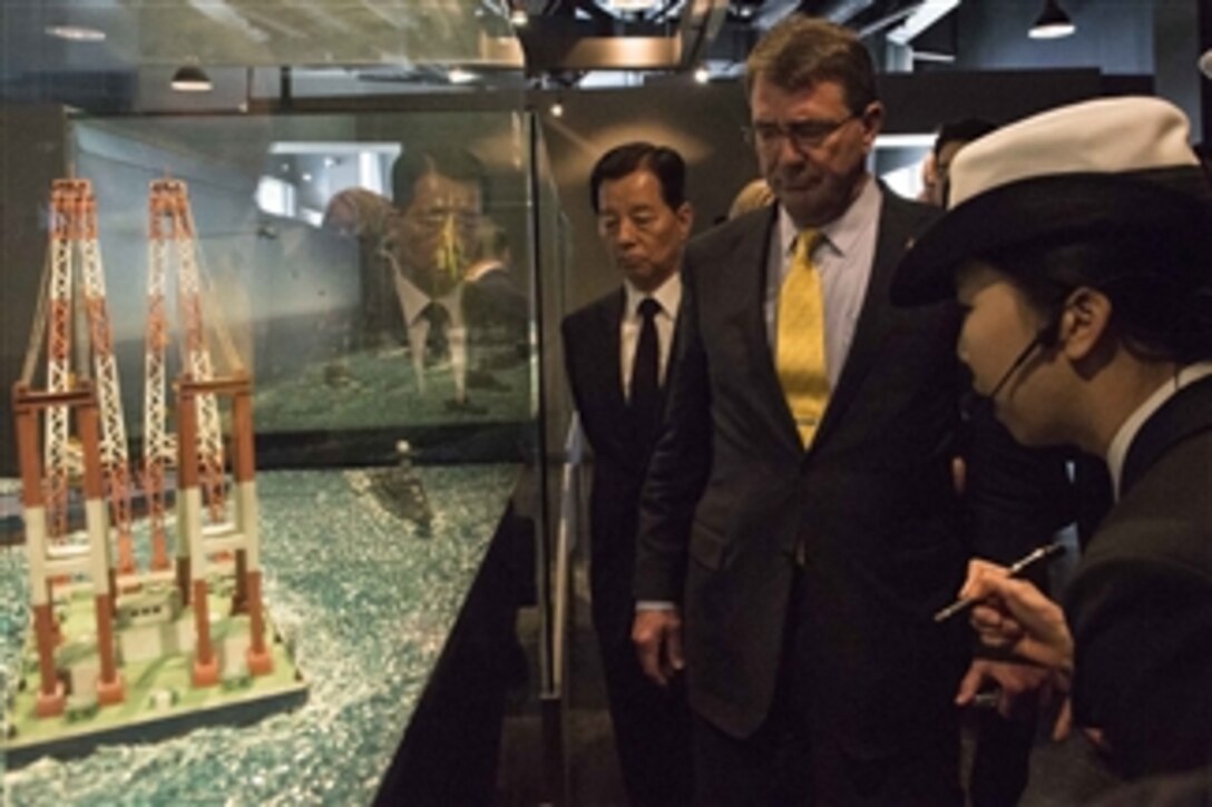U.S. Defense Secretary Ash Carter, right center, tours West Sea Protection Hall on Pyeongtaek Naval Base, South Korea,  April 10, 2015. Carter is on a visit to the U.S. Pacific Command Area of Responsibility to make observations for the future force and the rebalance to the Pacific.